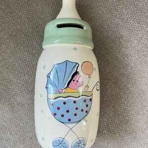 Decorative ceramic coin bank shaped like a baby bottle carriage design 8" x 3.5